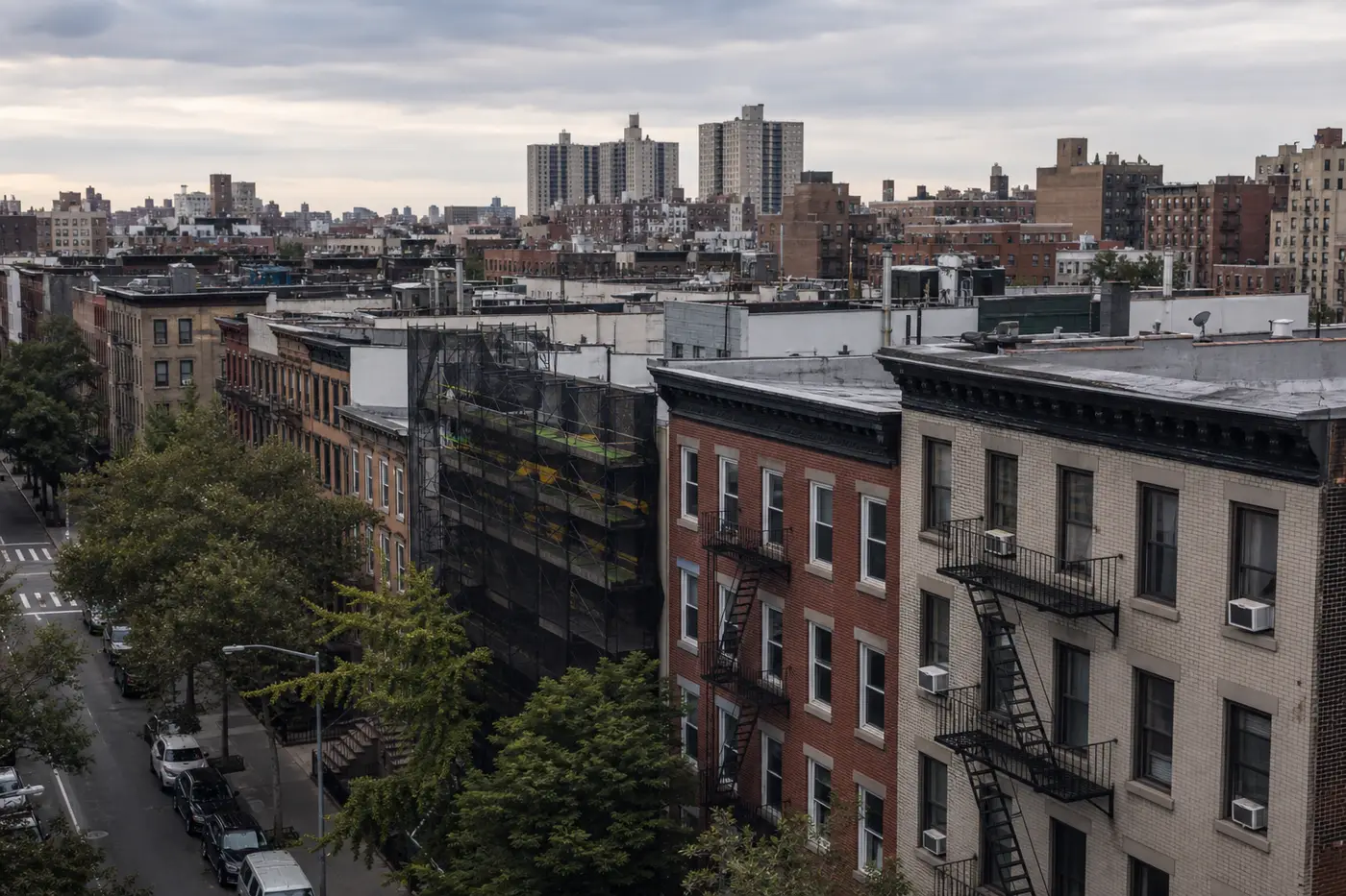 New York City residential street with brownstones and rooftops